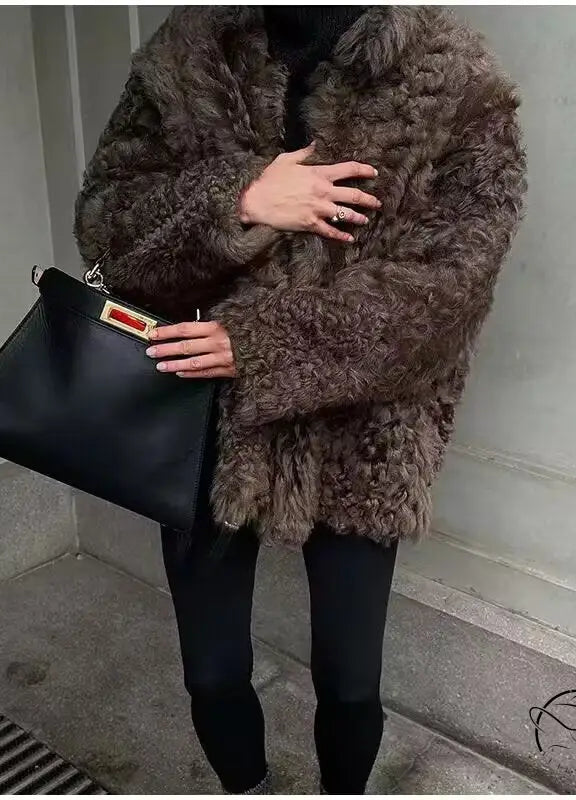 Casual big fur terry coat with brown fur, black leather handbag, red tag