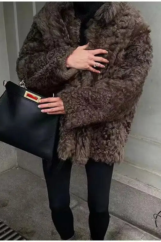 Casual big fur terry coat with brown fur, black leather handbag, red tag