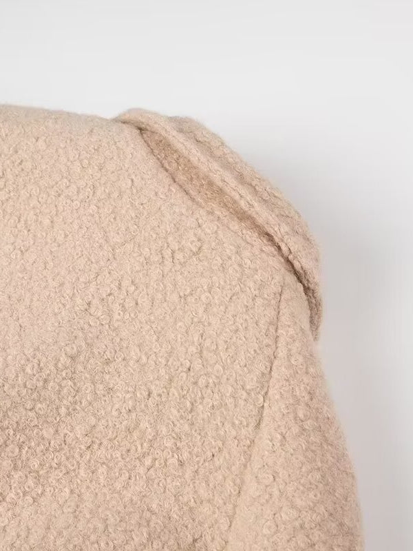 Beige textured bath towel with folded corner in Langry double breasted fashion overcoat