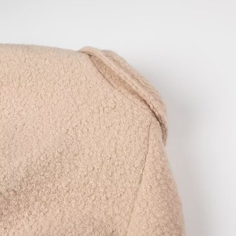 Beige textured bath towel with folded corner in Langry double breasted fashion overcoat