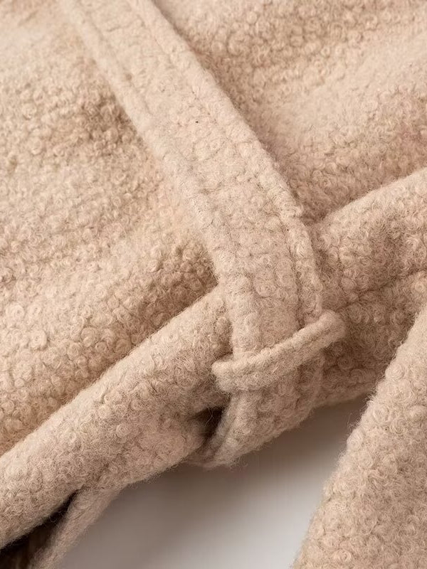 Beige sherpa double breasted overcoat with textured surface