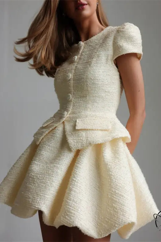 Enchanting short sleeve cream tweed peplum dress with buttons