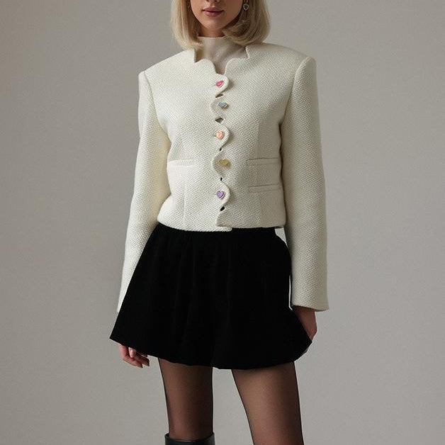 Langry fashion cream textured cropped jacket with white buttons and black skirt