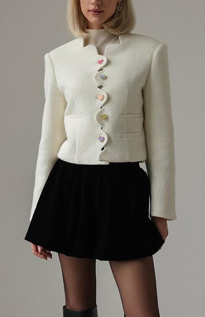 Langry fashion cream textured cropped jacket with white buttons and black skirt