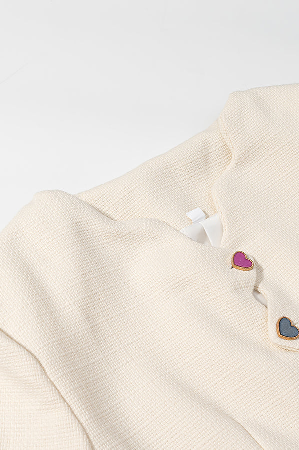 Langry cream cardigan coat with colorful heart buttons and metallic accents