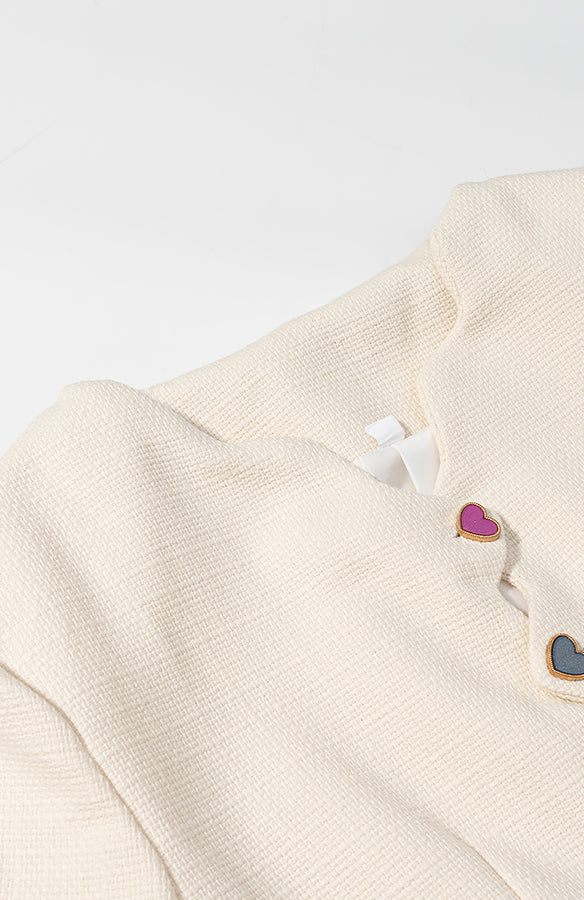 Langry cream cardigan coat with colorful heart buttons and metallic accents