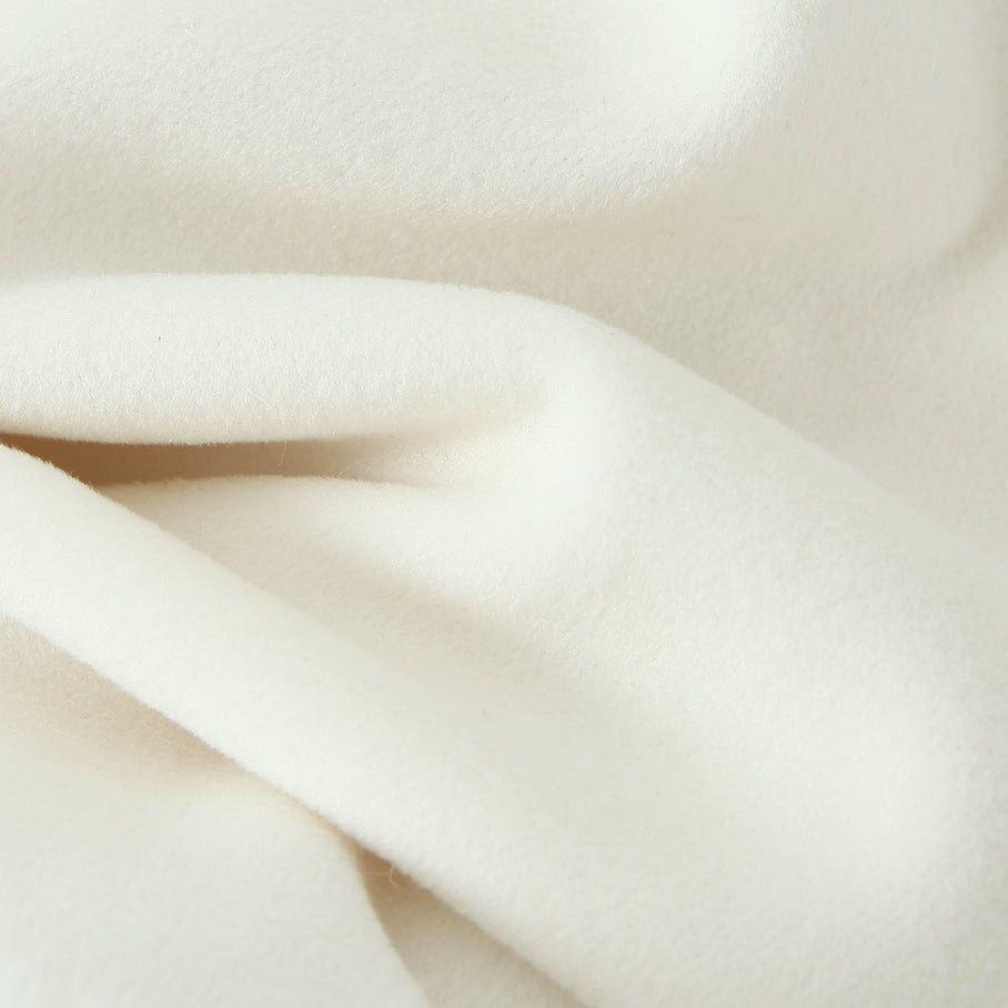 Elegant white silk scarf with soft folds on Langry fashion woolen jacket