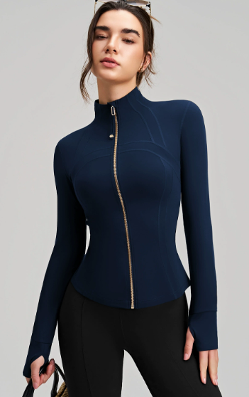 Navy blue long sleeve yoga jacket with gold zipper and black leggings