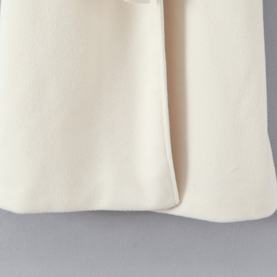 Elegant langry fashion cream cashmere scarf on white wool coat