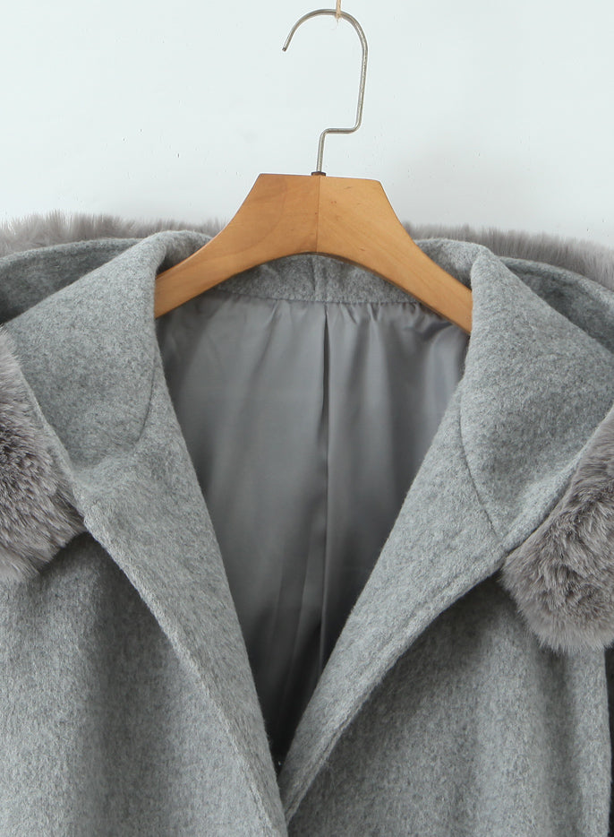 Langry fashion winter mid-length woolen hooded overcoat in gray with fur trim on wooden hanger