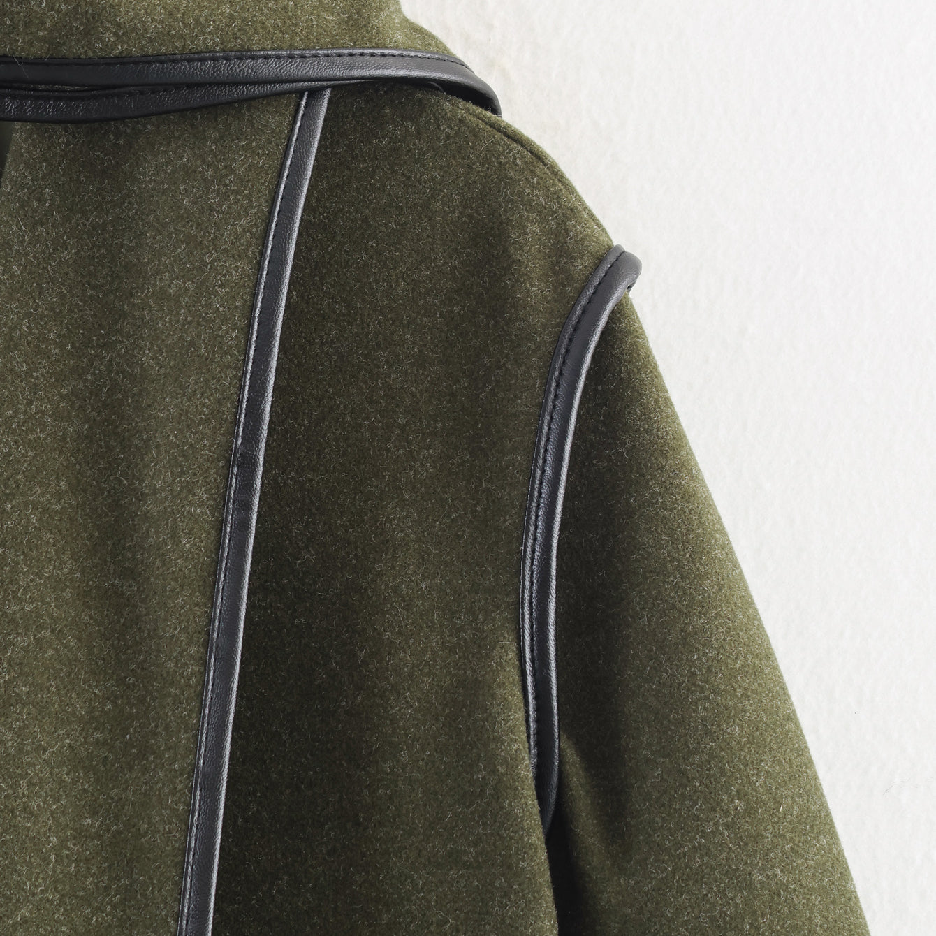 Olive green Langry wool coat with black leather accents and classic collar