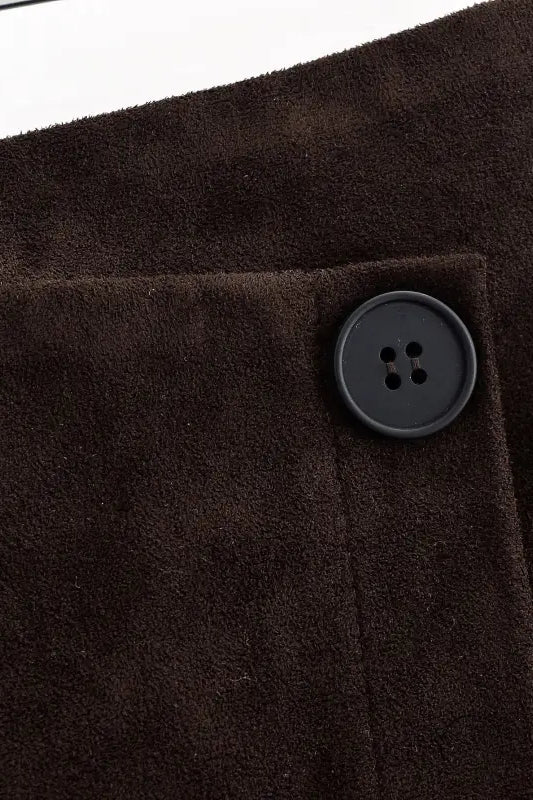 Brown suede fashion jacket with black buttons on langry sheath skirt