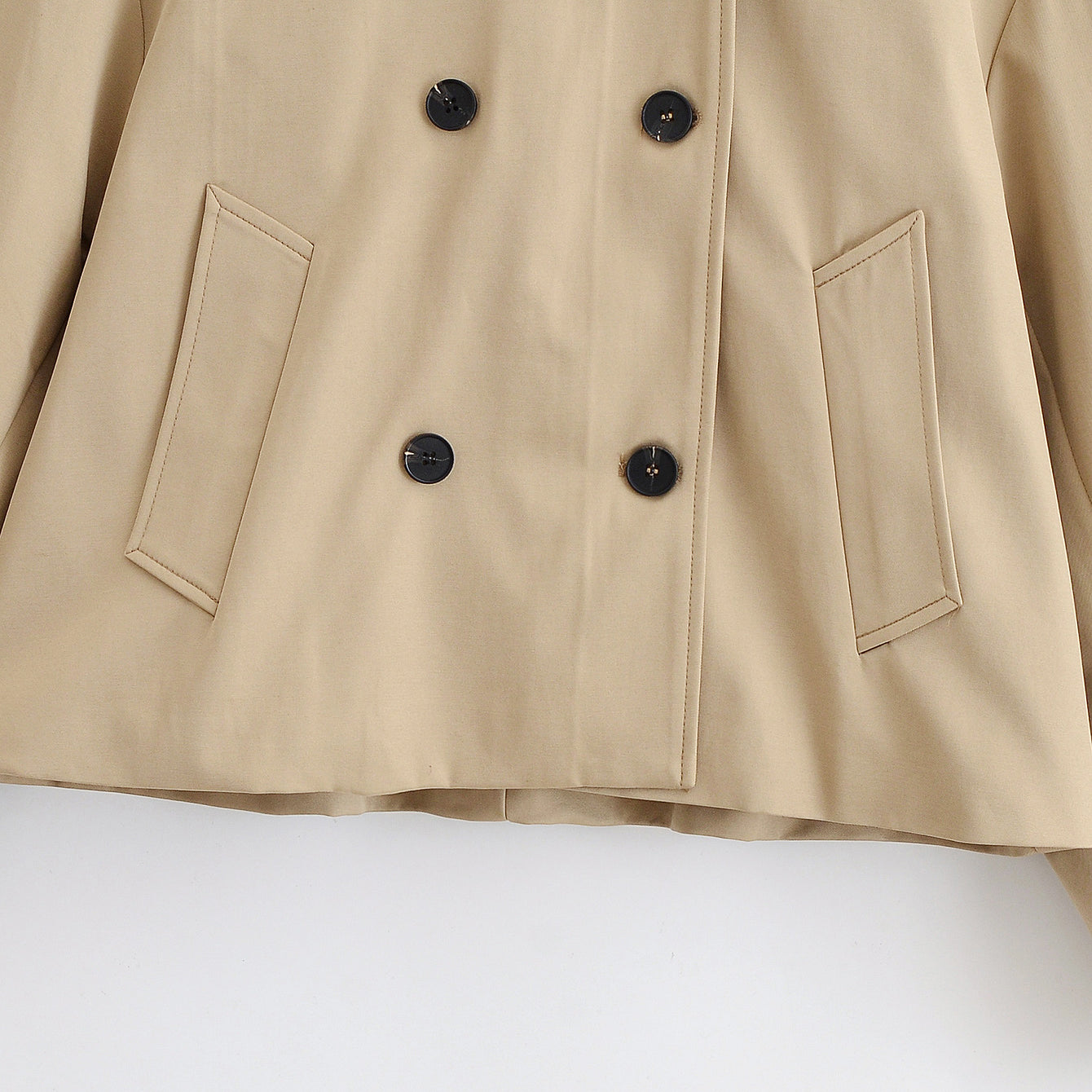 Enchanting Langry short khaki trench coat in beige with double-breasted buttons and patch pockets