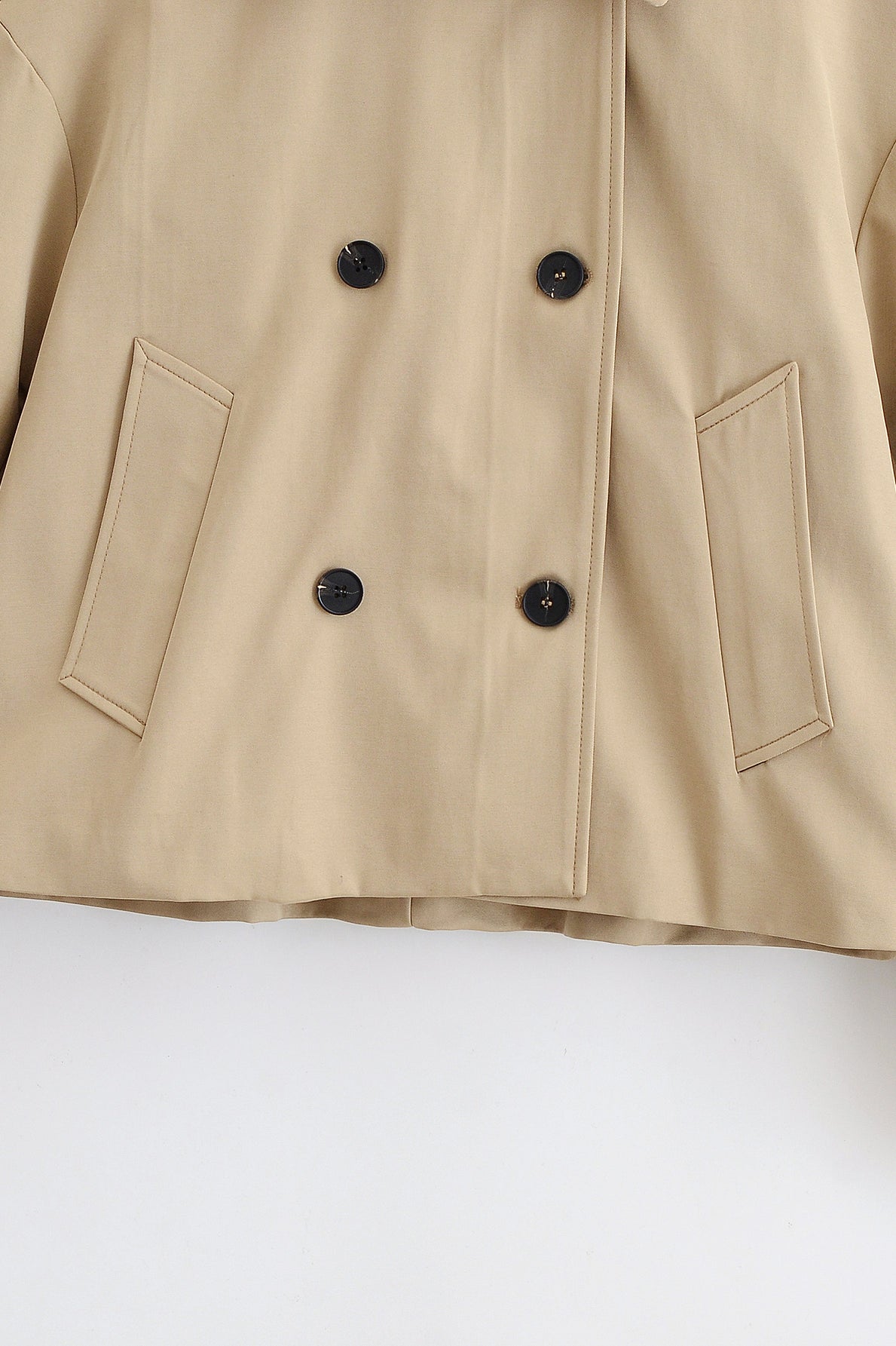 Enchanting Langry short khaki trench coat in beige with double-breasted buttons and patch pockets