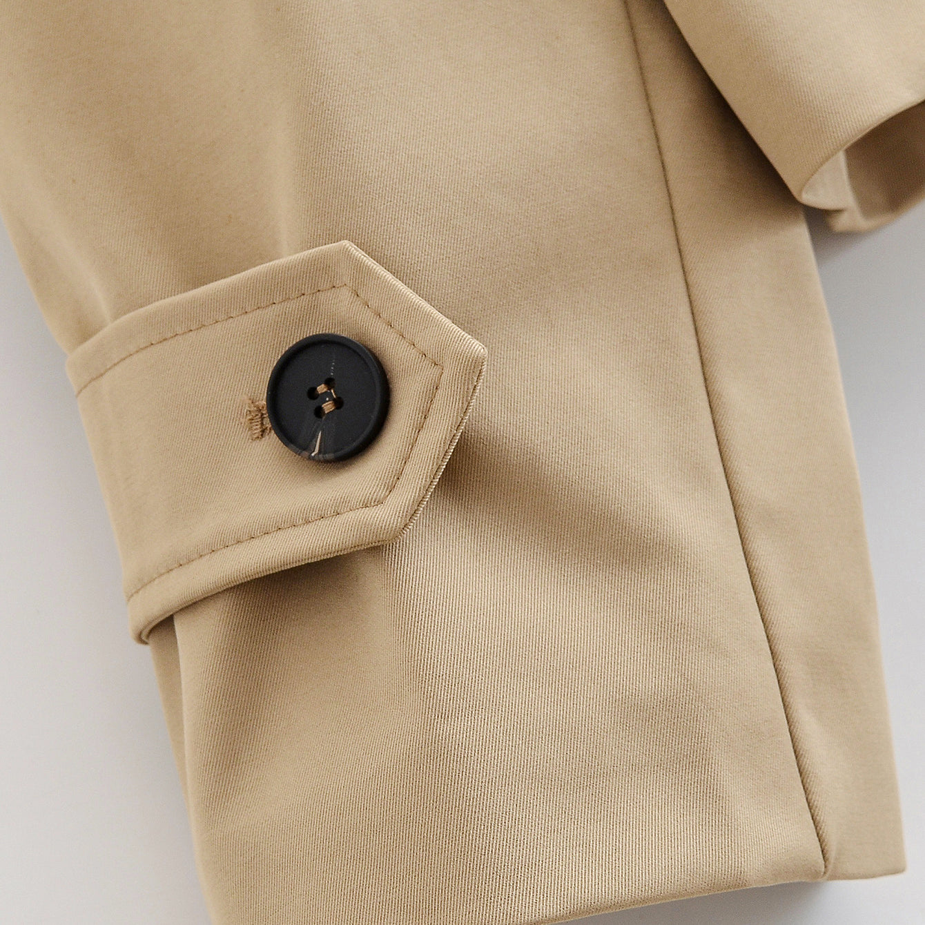 Enchanting Capable Short Khaki Trench Coat in beige with black buttons, classic Langry fashion ملابس