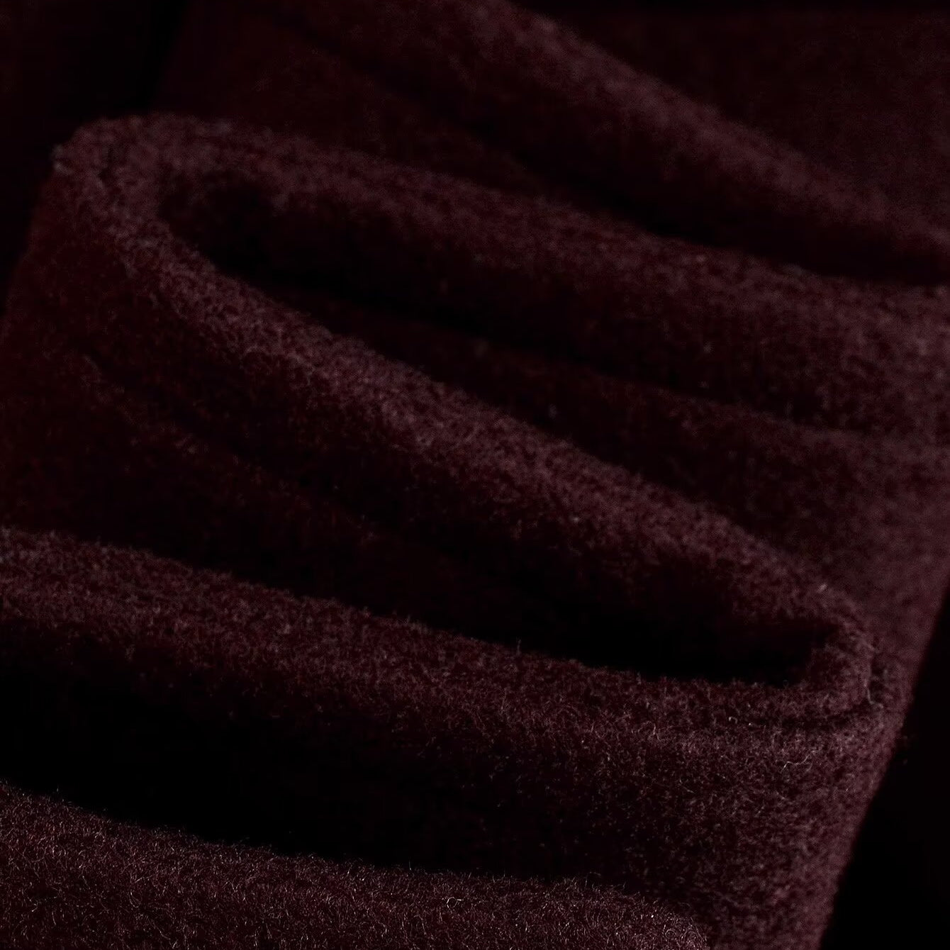 Dark red textured langry woolen overcoat with ribbed cuffs