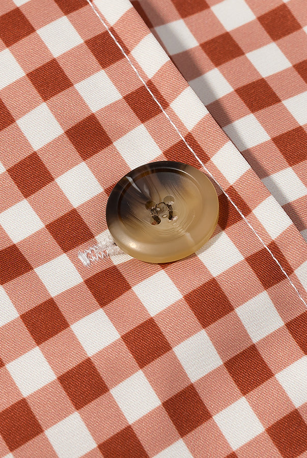 Casual plaid trench coat in red white checkered fabric with gold button