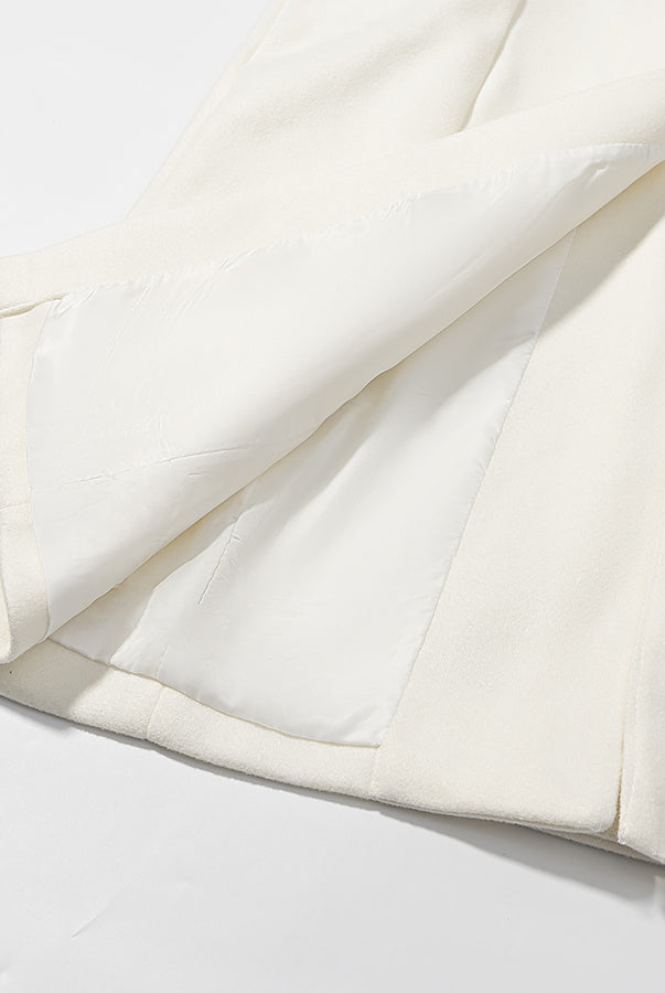 Langry fashion cream-colored woolen blazer with black stitching and pockets