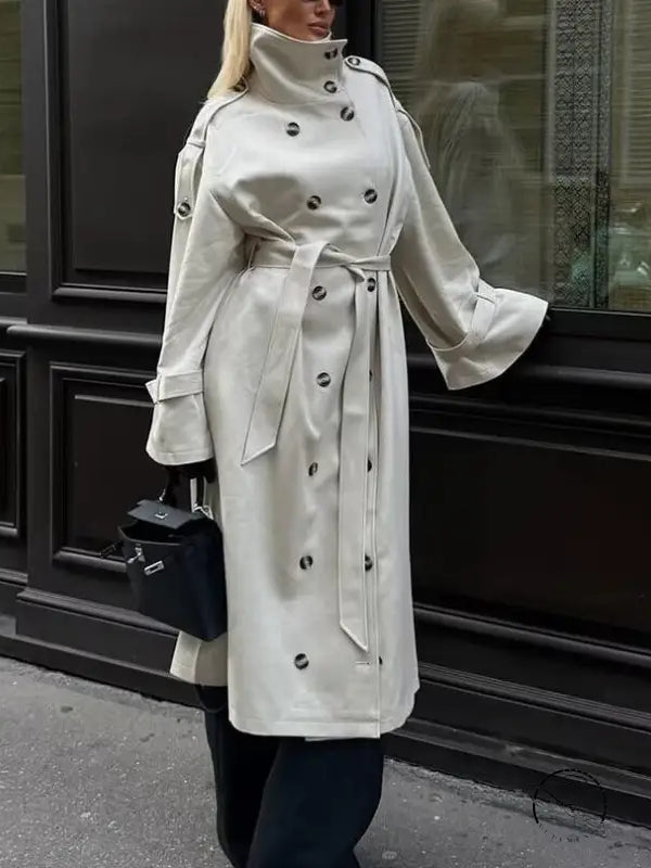 Cream double-breasted trench coat in windbreaker winter fashion