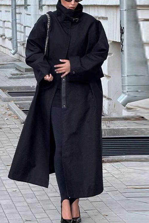 Fashionable black long trench coat with oversized sleeves and zipper details