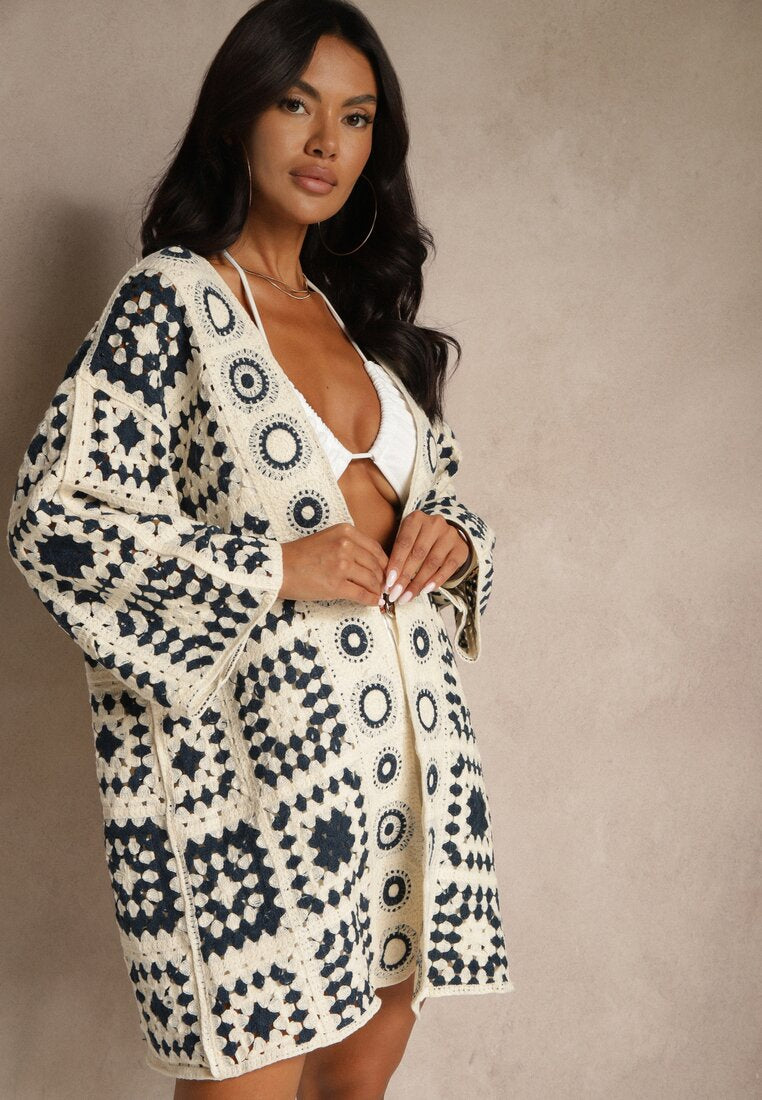 Cream and navy blue crocheted long-sleeved cardigan with geometric pattern