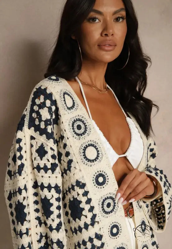 Cream navy crocheted open-front cardigan with starburst patterns, long sleeve fashion top