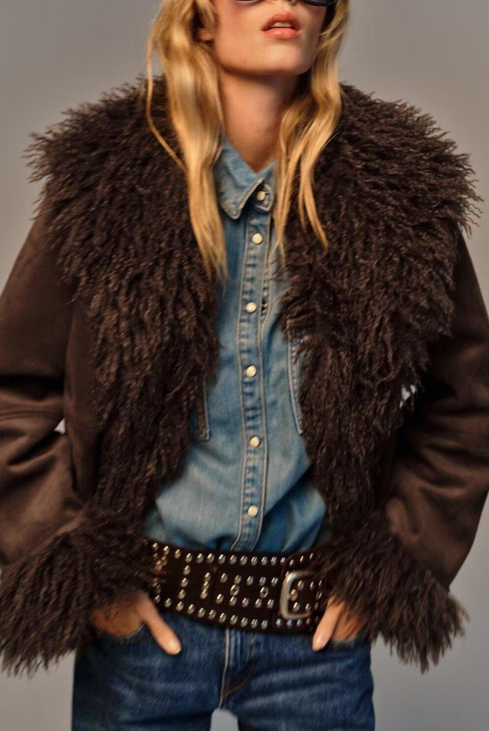 Elegant faux shearling autumn coat with fur trim and studded belt