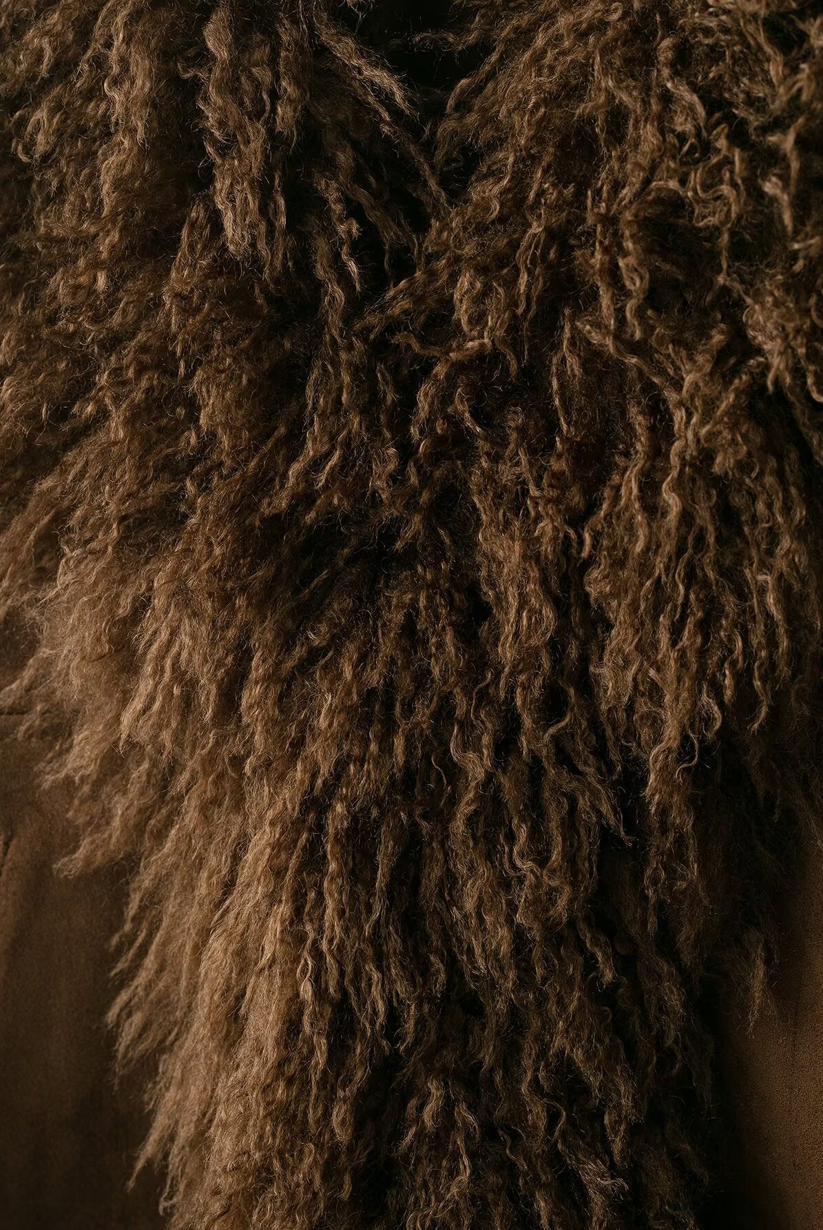 Elegant Autumn faux shearling coat with brown curly, shaggy fur texture