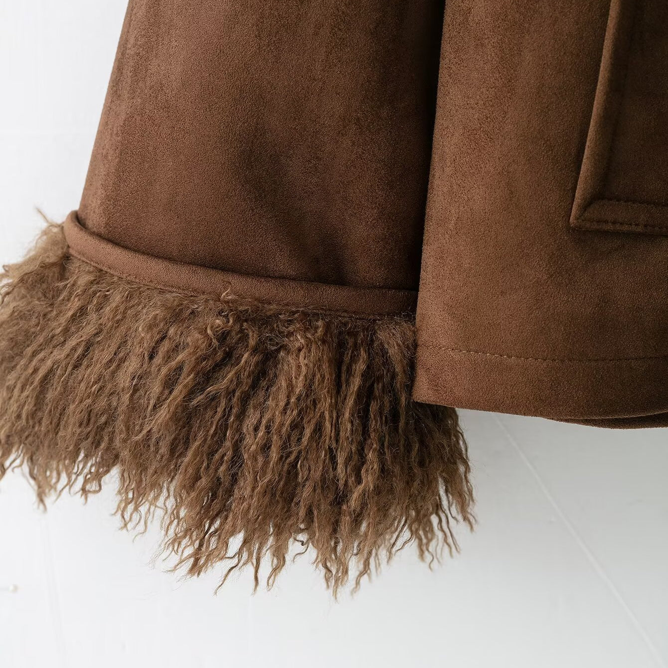 Elegant autumn faux shearling coat in brown suede with fringed hem