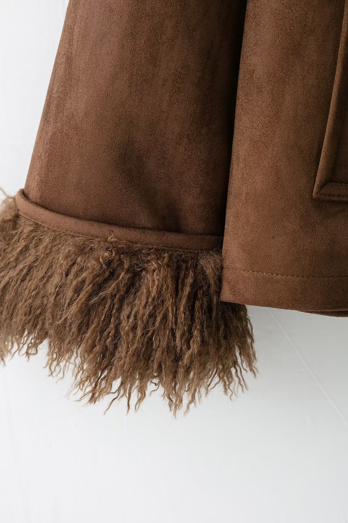 Elegant autumn faux shearling coat in brown suede with fringed hem