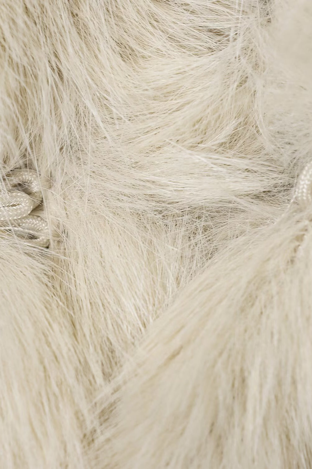 Cream faux fur throw blanket with textured pile and soft sheen for Langry fashion