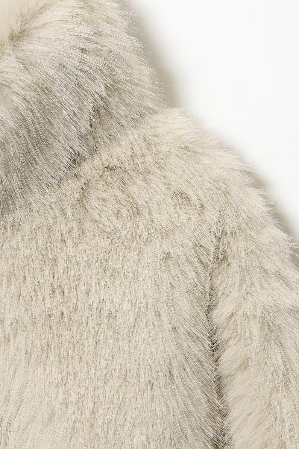 Cream faux fur jacket with hood and textured details