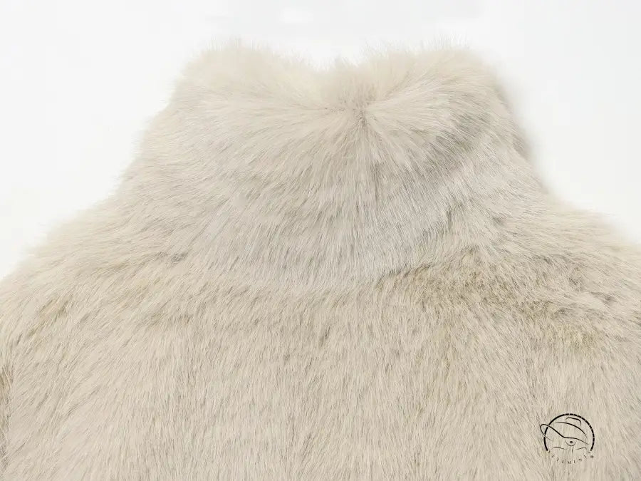 Cream faux fur vest in fur effect short coat with high collar and textured surface