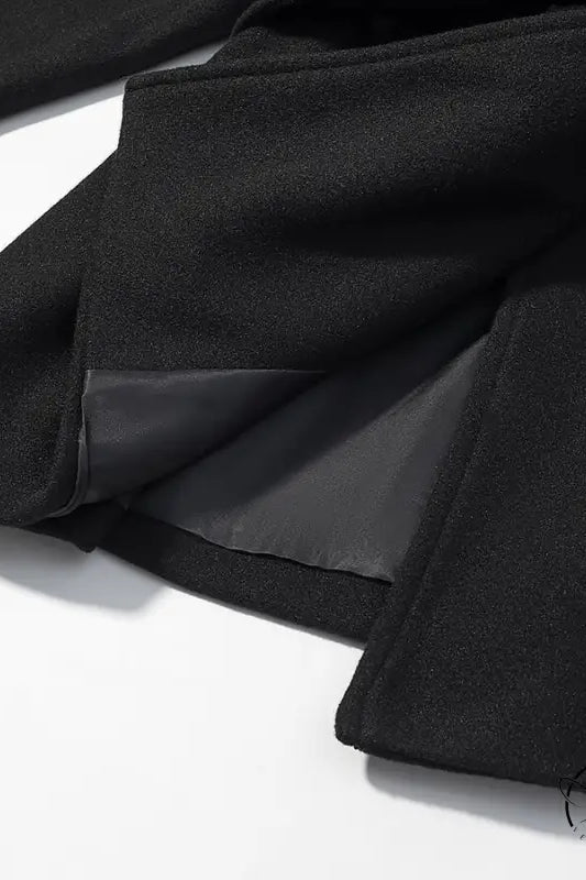 Elegant woolen coat with black ruffled skirt, elastic waistband