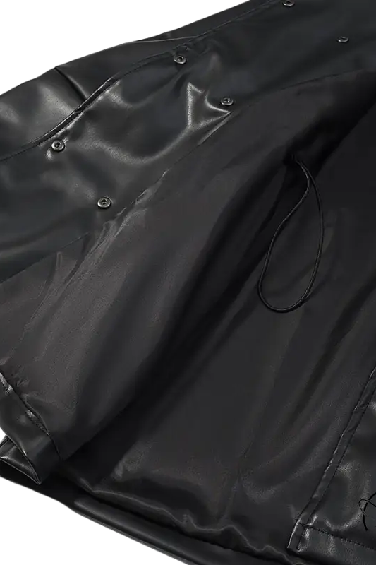 Black faux leather coat with glossy raincoat style, button closure, drawstring hem by Langry