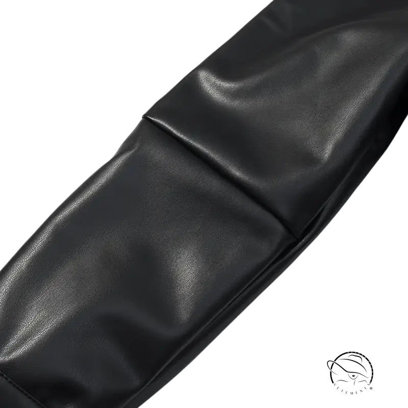 Black faux leather belt with textured surface and silver buckle for Langry coat