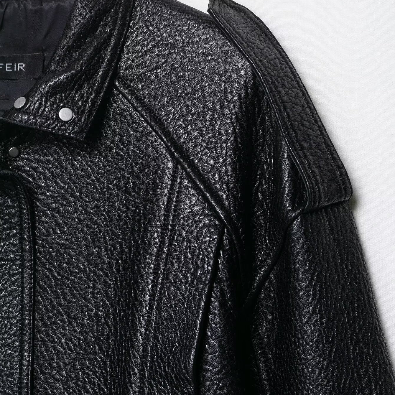 Elegant drop shoulder faux leather bomber jacket with textured surface and snap buttons by Langry fashion