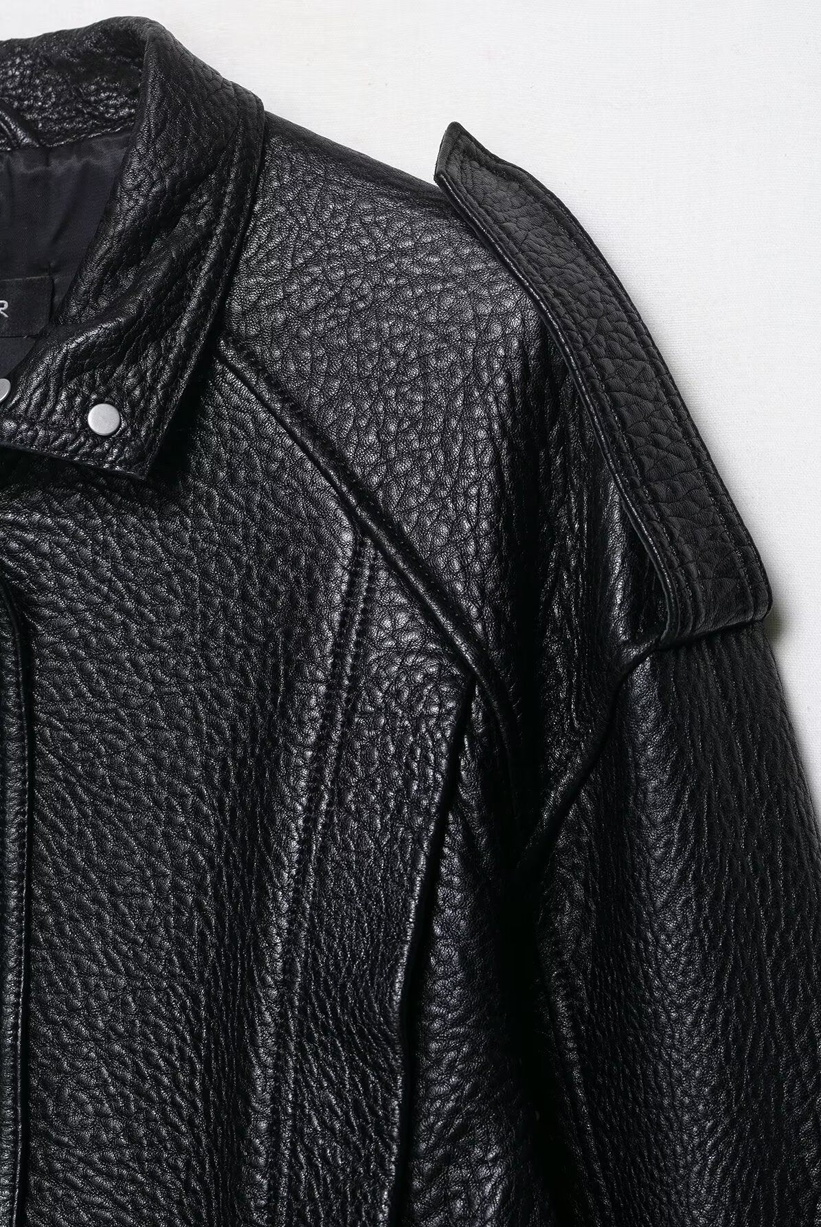 Elegant drop shoulder faux leather bomber jacket with textured surface and snap buttons by Langry fashion