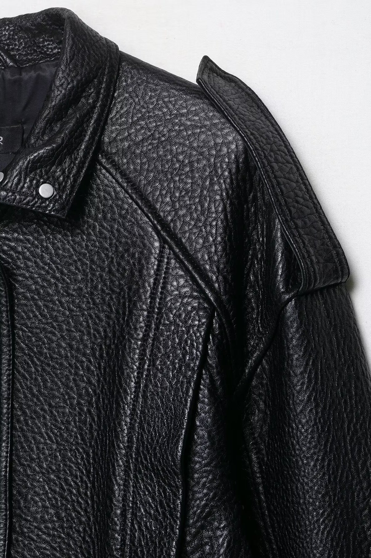 Elegant drop shoulder faux leather bomber jacket with textured surface and snap buttons by Langry fashion