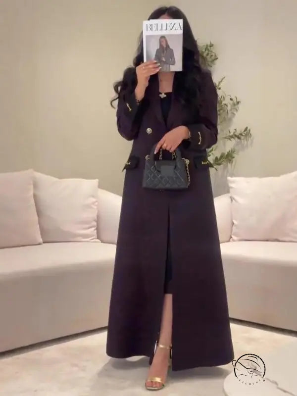 Black quilted handbag with gold-tone chain strap in Langry fashion trench coat