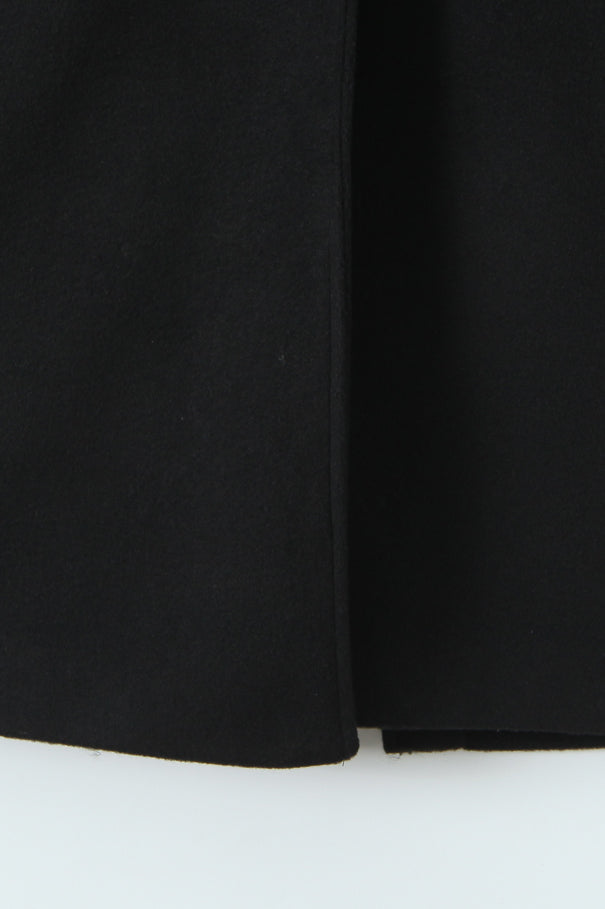 Langry fashion black pleated skirt with hem slit for woolen coat