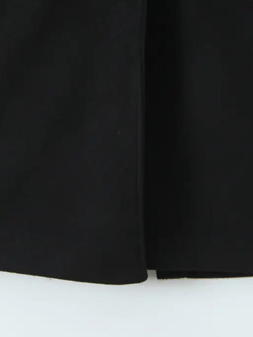 Langry fashion black pleated skirt with hem slit in woolen coat