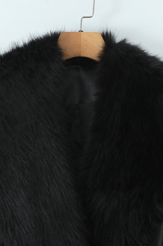 Langry black leather fur-trimmed winter jacket on wooden hanger