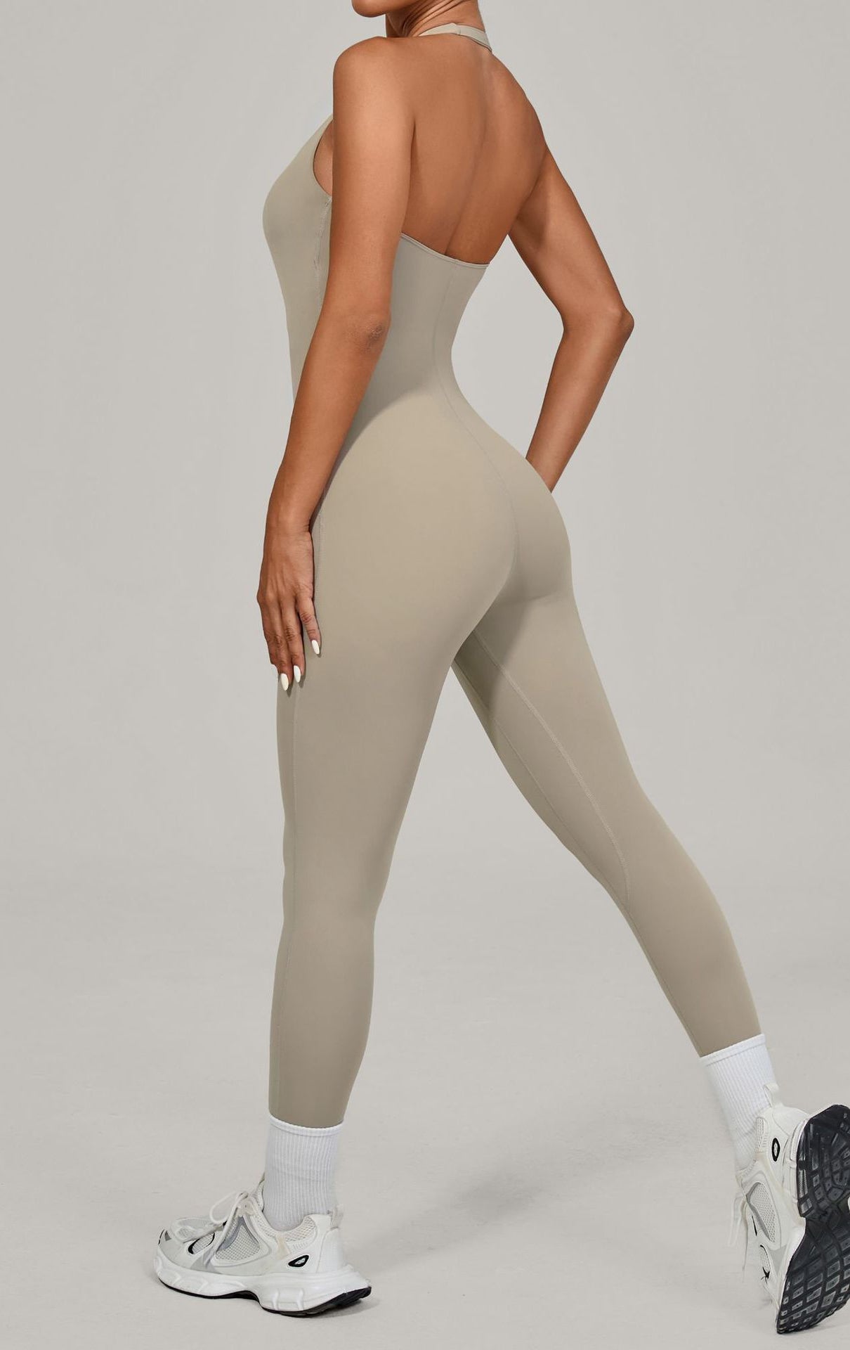 Sleek beige langry halter yoga jumpsuit for outdoor fashion ملابس