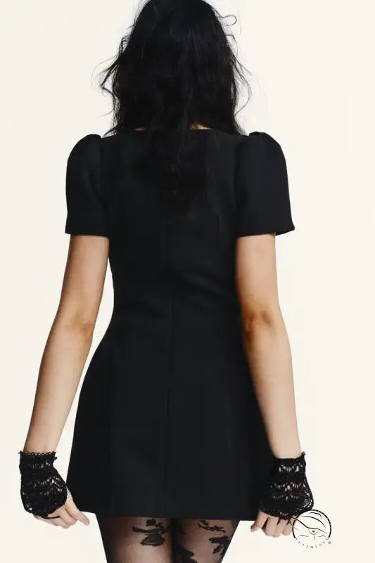 Enchanting short pleated pocket dress with black short sleeves, puffed shoulders, and lace gloves