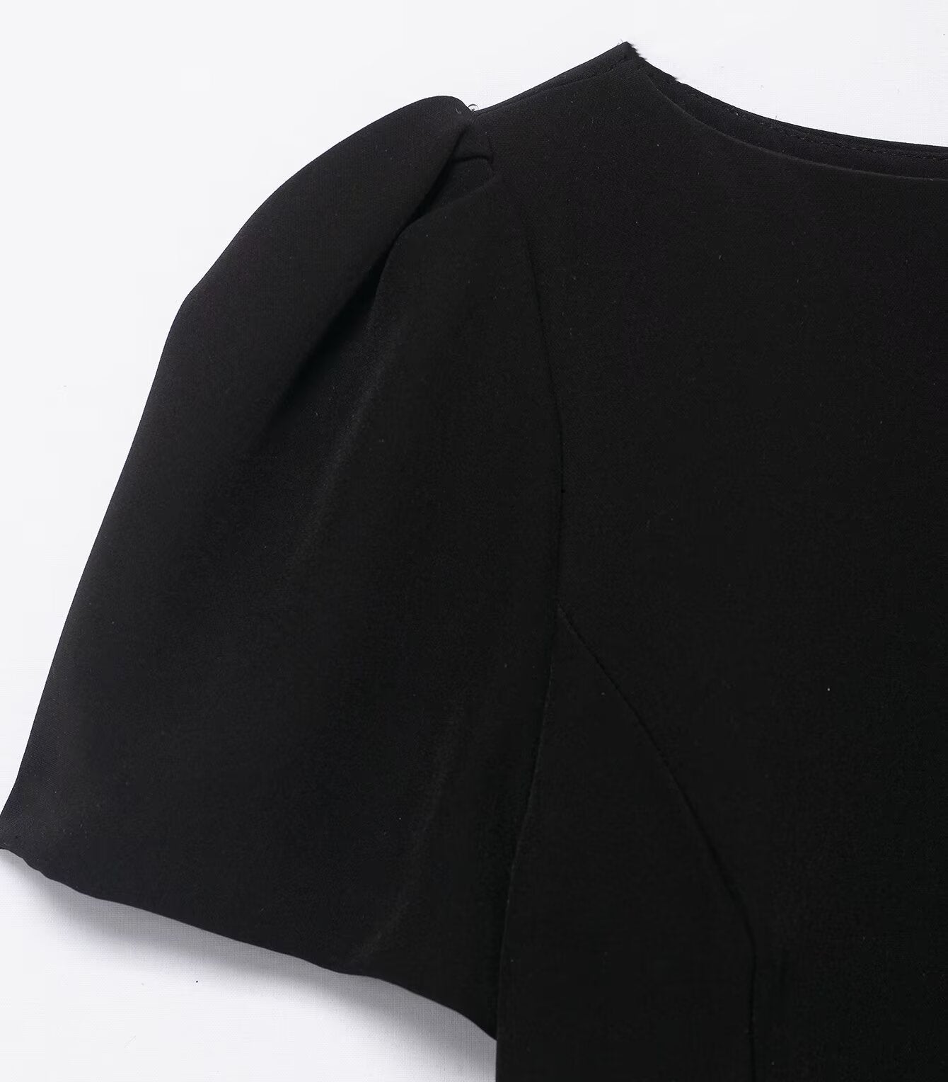 Enchanting black langry fashion dress with puffed short sleeves and pleated pockets