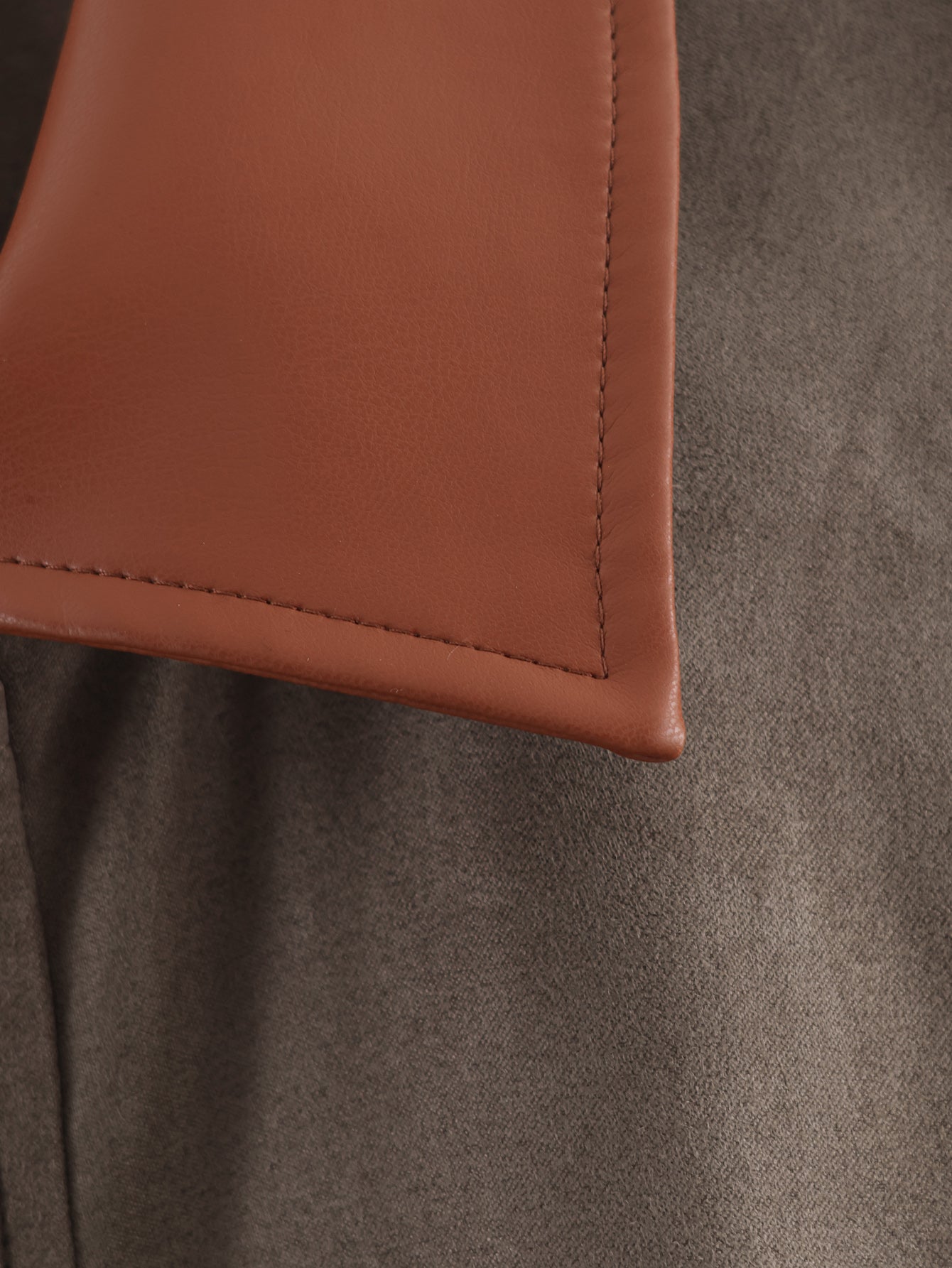 Tan leather wallet corner with stitched edges in Langry fashion ملابس