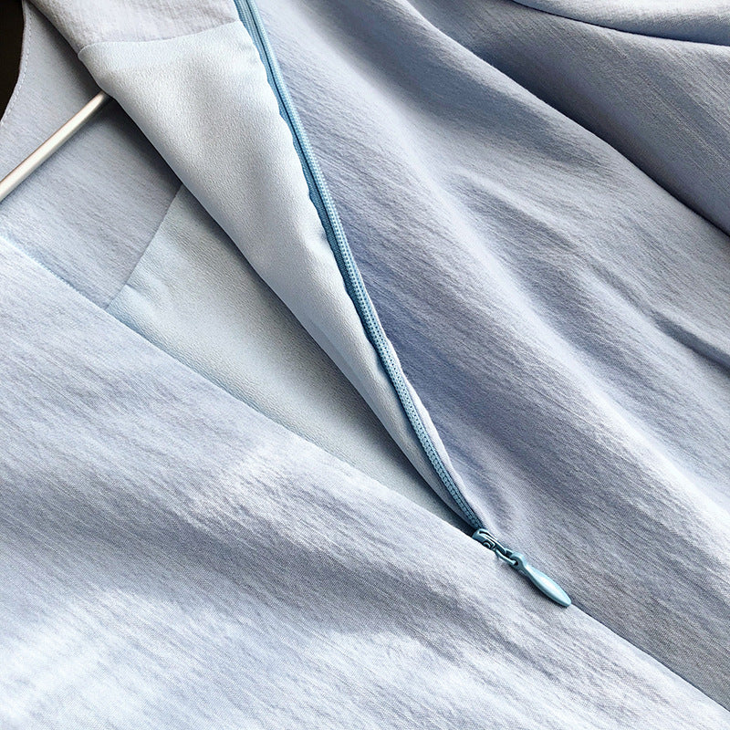 Light blue fabric with zipper showcasing French Elegant Puff Sleeve Dress design