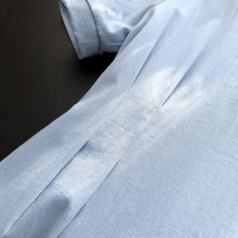 Light blue textured shirt featured in French Elegant Puff Sleeve Dress showcasing an elegant puff sleeve style