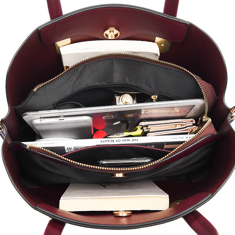 Burgundy leather handbag with organized compartments for elegant fashion and ملابس essentials